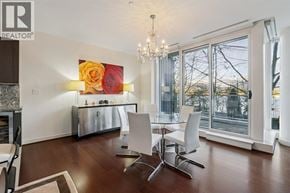 Vancouver townhouse for rent - A living room with a large painting of a rose on the wall.