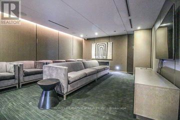 Toronto (Church-Yonge Corridor) condo for rent - A living room with a grey couch and a black ottoman.