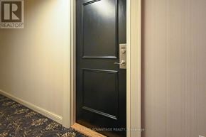 Toronto (Kennedy Park) condo for rent - A black door with a silver handle and a number 5853 on it.