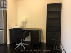 Mississauga (Creditview) condo for rent - A black chair is in front of a black desk with a computer on it.
