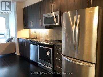 Mississauga (Creditview) condo for rent - A kitchen with a stainless steel refrigerator and microwave above the stove.