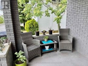 Niagara Falls (Downtown) multi-family for rent - A patio with a table and two chairs.