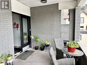 Niagara Falls (Downtown) multi-family for rent - A patio area with a table, chairs, and potted plants.