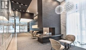 Toronto (Willowdale West) condo for rent - A modern office lobby with a reception desk and chairs.