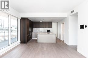 Richmond apartment for rent - A modern kitchen with a white island and wooden floors.
