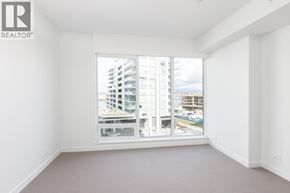 Richmond apartment for rent - A large window with a view of a cityscape.