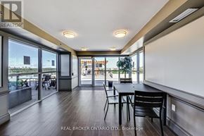 Toronto (Englemount-Lawrence) condo for rent - A dining area with a table and chairs is shown in the image.