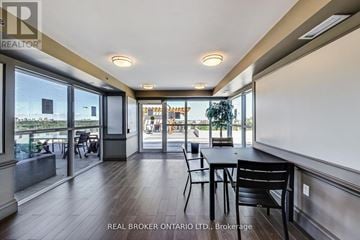 Toronto (Englemount-Lawrence) condo for rent - A dining area with a table and chairs is shown in the image.