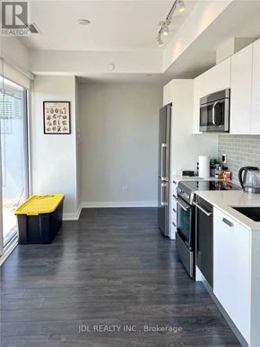 Toronto (Church-Yonge Corridor) condo for rent - A room with a black chair and a desk with a white cabinet.