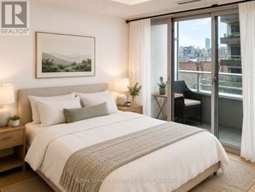 Toronto (Niagara) condo for rent - A bedroom with a large bed and a view of the city.