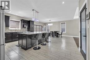 Lasalle apartment for rent - A modern kitchen with a bar area and a dining table.