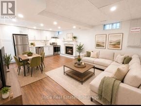 East Gwillimbury (Holland Landing) apartment for rent - A well-lit, modern living room with a dining area and a fireplace.