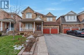 Brampton (Sandringham-Wellington) apartment for rent - A house with a car parked in front of it.