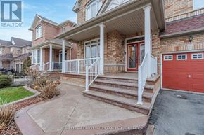 Brampton (Sandringham-Wellington) apartment for rent - A house with a red garage door is for sale.