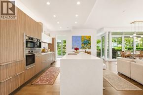 Vancouver apartment for rent - A modern kitchen with wooden cabinets and a white island.