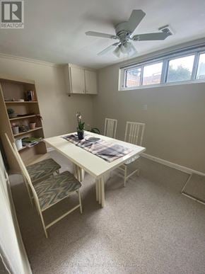 Toronto (Bathurst Manor) duplex for rent - A room with a table, chairs, and a ceiling fan.