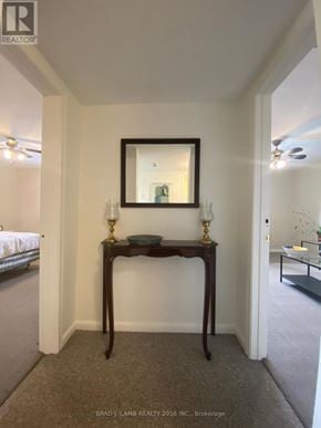 Toronto (Bathurst Manor) duplex for rent - A bedroom with a bed and a table with a mirror.