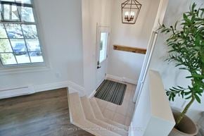 Blue Mountains townhouse for rent - A staircase with a carpeted runner and wooden handrail.
