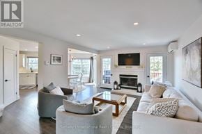 Blue Mountains townhouse for rent - A living room with a fireplace and a couch.