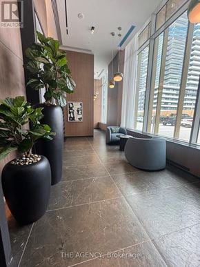 Pickering (Bay Ridges) condo for rent - A real estate agency's office lobby with a large window overlooking the street.