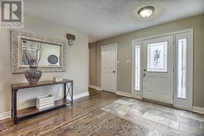 Newmarket (Stonehaven-Wyndham) apartment for rent - A hallway with a wooden floor and white walls.