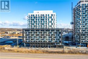 Oakville (Jm Joshua Meadows) condo for rent - A large building with many windows is under construction.