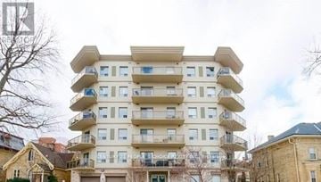London East (East F) condo for rent - A multi-story residential building with balconies and windows.