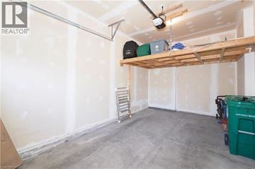 Kitchener townhouse for rent - A room under construction with a fan and a shelf.