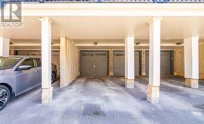 Hamilton (Waterdown) townhouse for rent - A car is parked in a garage with a sign that reads "Century 21 Green Realty Inc. Brokerage.".