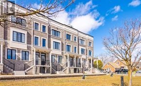 Hamilton (Waterdown) townhouse for rent - A building with a row of windows and balconies is shown in the image.