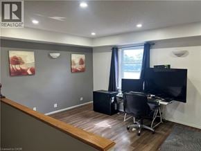 Cambridge apartment for rent - A room with a desk, chair, and television.