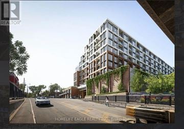 Toronto (Dovercourt-Wallace Emerson-Junction) condo for rent - A street view of a modern building with the sign "HOMELIFE EAGLE REALTY INC., Brokerage" on the bottom.