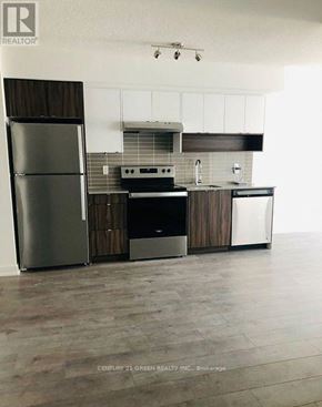 Burlington (Lasalle) condo for rent - A modern kitchen with a refrigerator, stove, and sink.