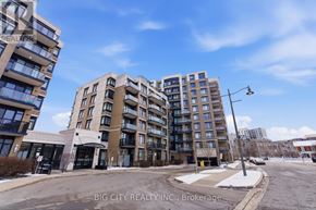 Markham (Unionville) condo for rent - A street view of a residential area with apartment buildings and a sign for Big City Realty Inc., Brokerage.