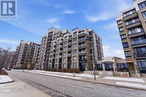 Markham (Unionville) condo for rent - A street view of apartment buildings with a clear blue sky above.