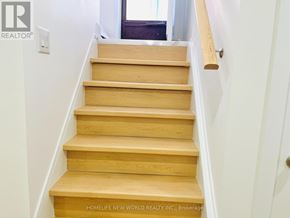 Toronto (Willowdale East) apartment for rent - A set of wooden stairs leading up to a door.