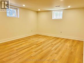 Toronto (Willowdale East) apartment for rent - A room with wooden flooring and two windows.