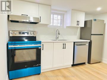 Toronto (Willowdale East) apartment for rent - A blue oven in a white kitchen with wooden floors.