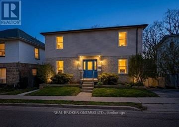 Cambridge triplex for rent - A house with a blue door is shown in the image.