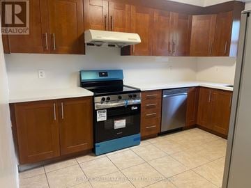 Richmond Hill (Crosby) apartment for rent - A kitchen with a stove top oven and a dishwasher.