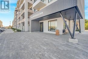 Milton (Cb Cobban) condo for rent - A modern building with a glass entrance and a sign that reads "740 Whidlock Ave.".