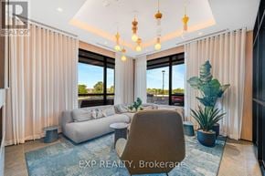 Milton (Cb Cobban) condo for rent - A well-lit living room with a large window and a comfortable seating area.
