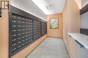 Milton (Cb Cobban) condo for rent - A long hallway with a row of mailboxes on the wall.