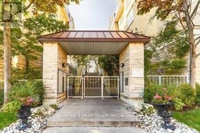 Toronto (Niagara) townhouse for rent - The image shows a real estate office entrance with a gate and a sign that reads "Master's Trust Realty Inc., Broker."