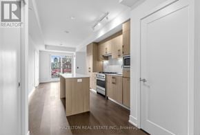 Toronto (Yonge-Eglinton) condo for rent - A modern kitchen with wooden cabinets and appliances.