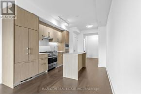 Toronto (Yonge-Eglinton) condo for rent - A modern kitchen with wooden cabinets and appliances.