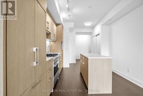 Toronto (Yonge-Eglinton) condo for rent - A modern kitchen with wooden cabinets and appliances.