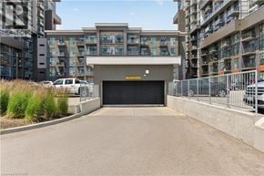 Waterdown condo for rent - A large black garage door is the centerpiece of this image.