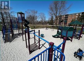 Welland (Prince Charles) condo for rent - A playground with a blue slide and a red railing.
