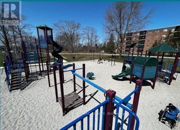 Welland (Prince Charles) condo for rent - A playground with a blue slide and a red railing.
